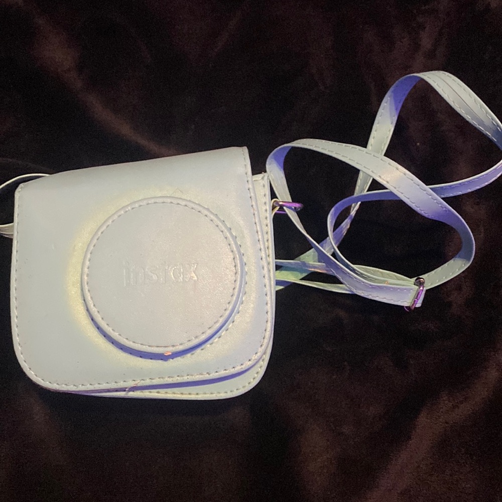 Instax Camera and Case. It is a n instax mini 7S. Only used a couple of times.